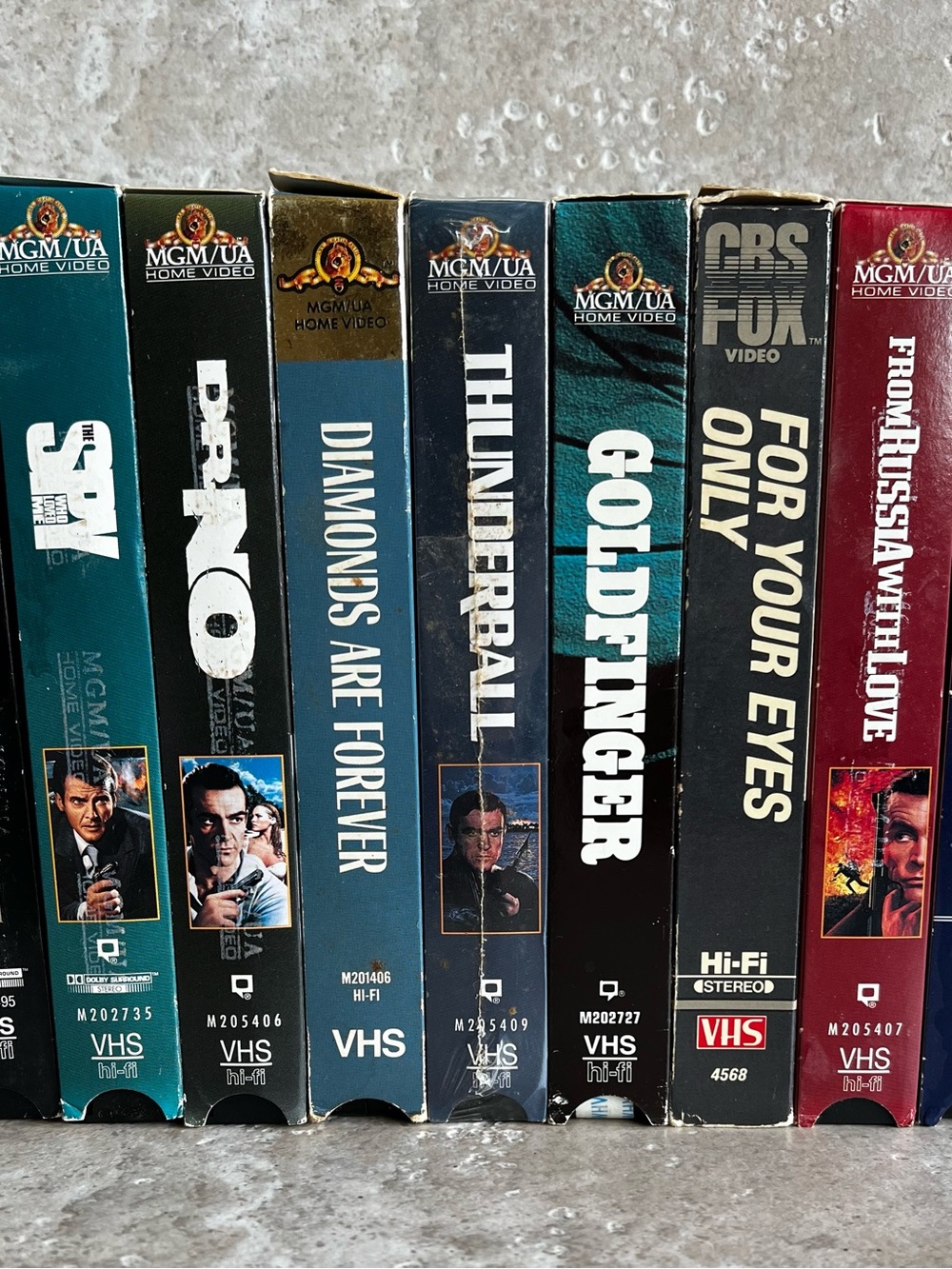 Source Unknown James Bond VHS Box Spines — Teal, Black, Navy, Burgundy